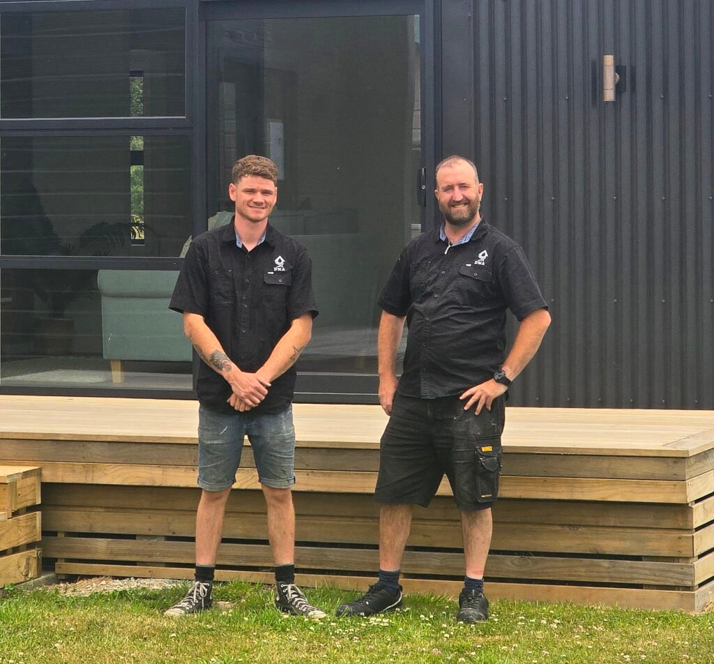 Roofing Lower Hutt Owners Dan Smith and Tu Gillam standing side by side.